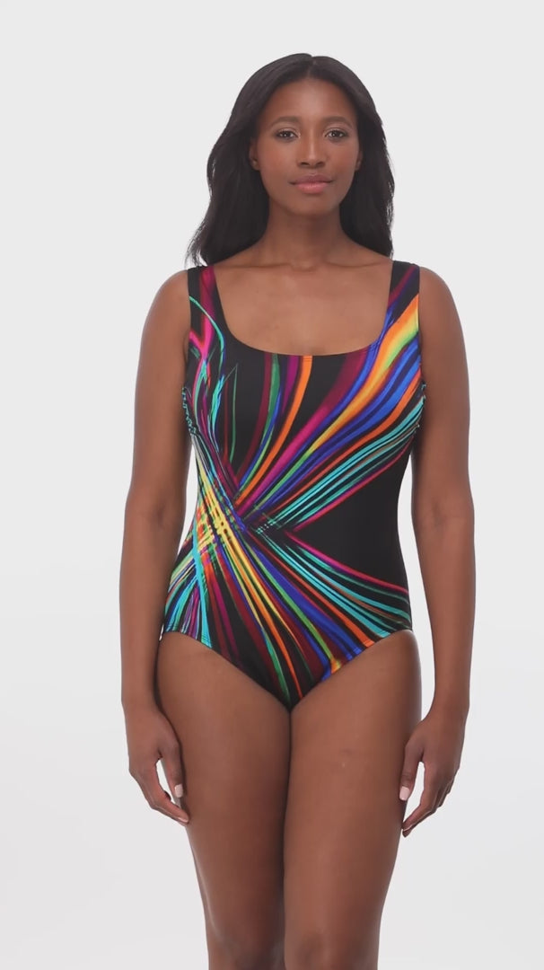 Woman wearing a multicolored stripey light pattern one-piece swimsuit