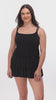 Woman wearing a black faint animal printed tiered swim dress