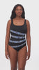 Woman wearing a dotted print four streak one-piece swimsuit