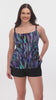 Woman wearing a multicolored streak printed ruffled swim shortini