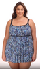 Woman wearing a multi-blue speckled swim dress with tiered ruffles