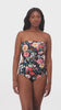 Woman wearing a floral printed bandeau one-piece swimsuit