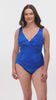 Woman wearing a blue streaked pattern one-piece swimsuit