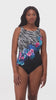 Woman wearing a half zebra print with blue and pink florals down the middle one-piece swimsuit