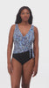 Woman wearing a blue dotted print ruffle neck one-piece swimsuit