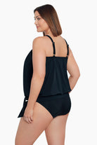 Woman turned left wearing a black high neck blouson tankini top