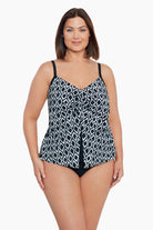 Woman wearing a black and white diamond pattern middle split tankini top