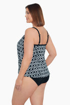 Woman turned left wearing a black and white diamond pattern middle split tankini 