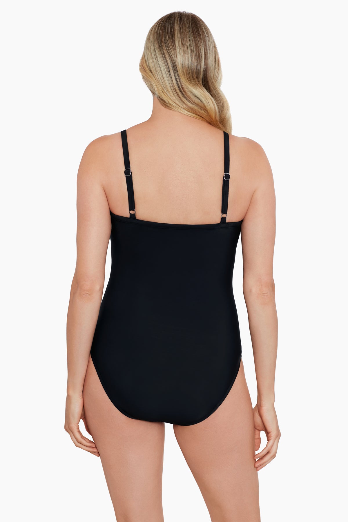 Woman turned away wearing a black one-piece swimsuit