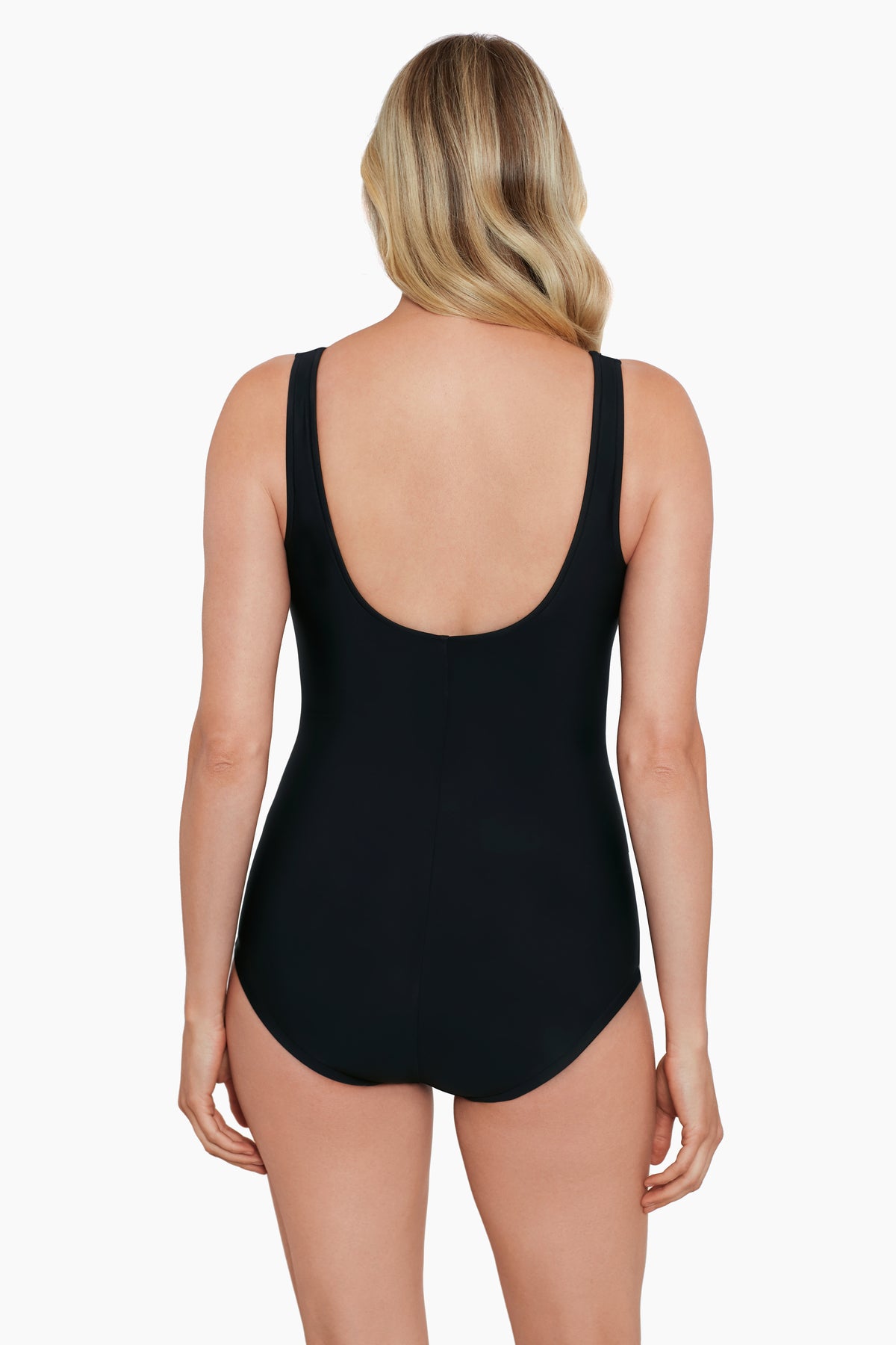 Woman faced away wearing a black one-piece swimsuit 