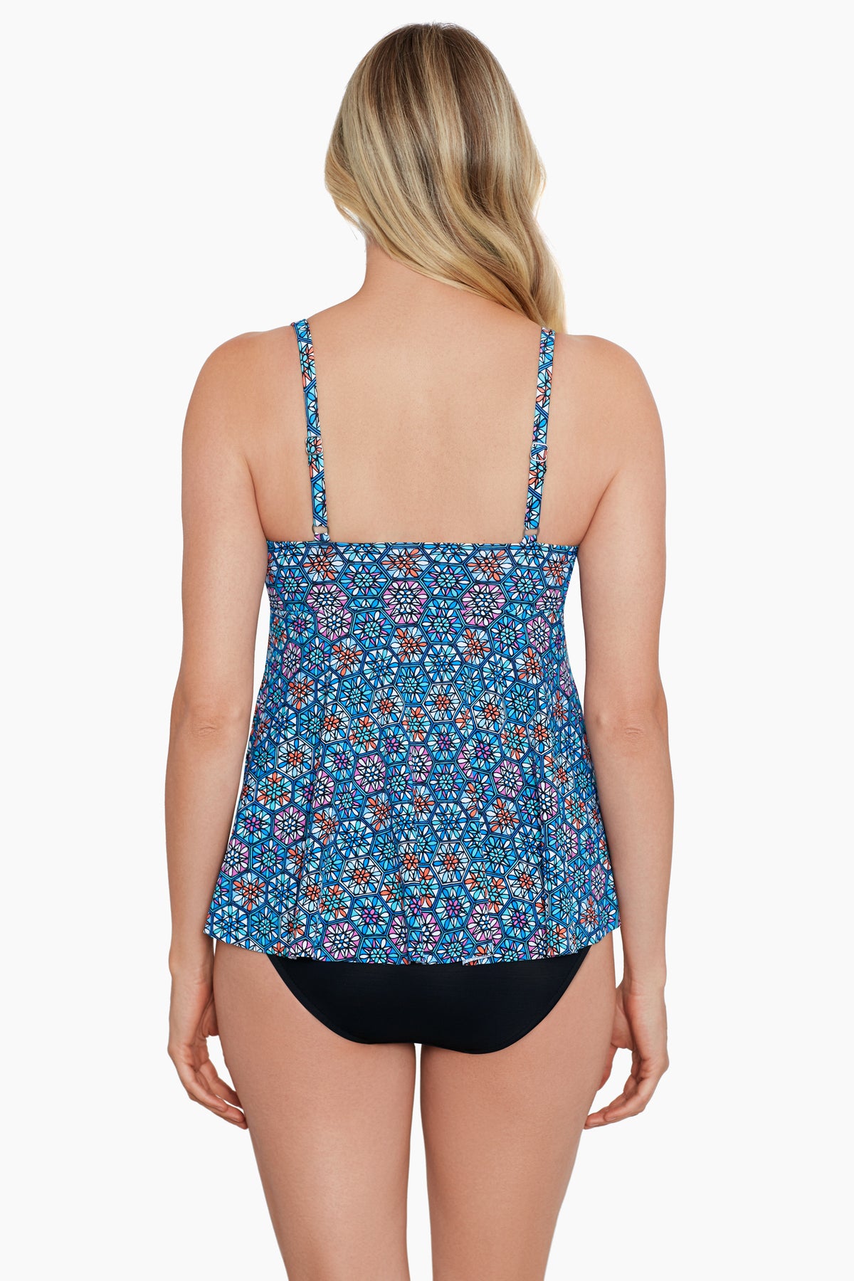 Woman turned away wearing a blue tile-esque printed tankini top