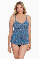 Woman wearing a blue tile-esque printed tankini top