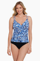 Woman wearing a blue and white abstract printed tankini top