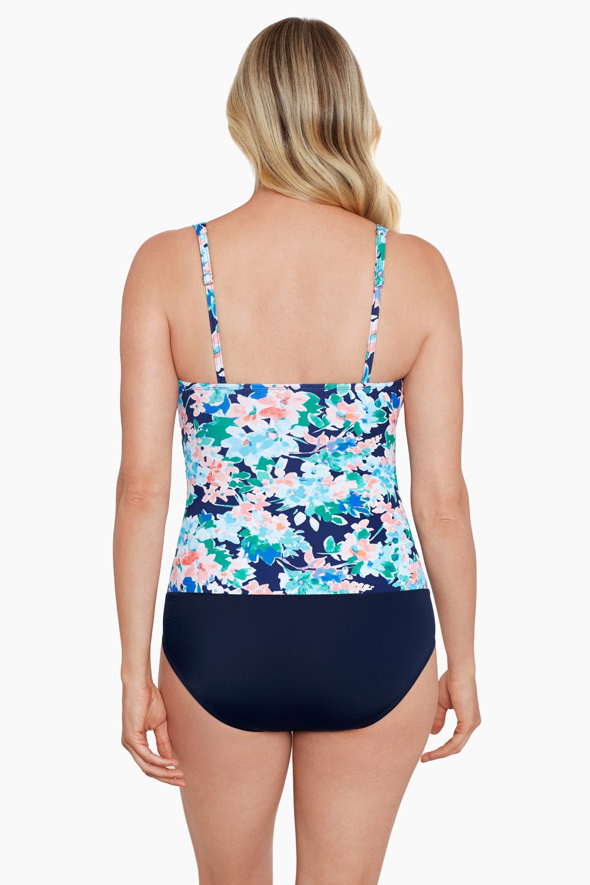 Woman turned away wearing a multicolored floral printed V neckline one-piece swimsuit