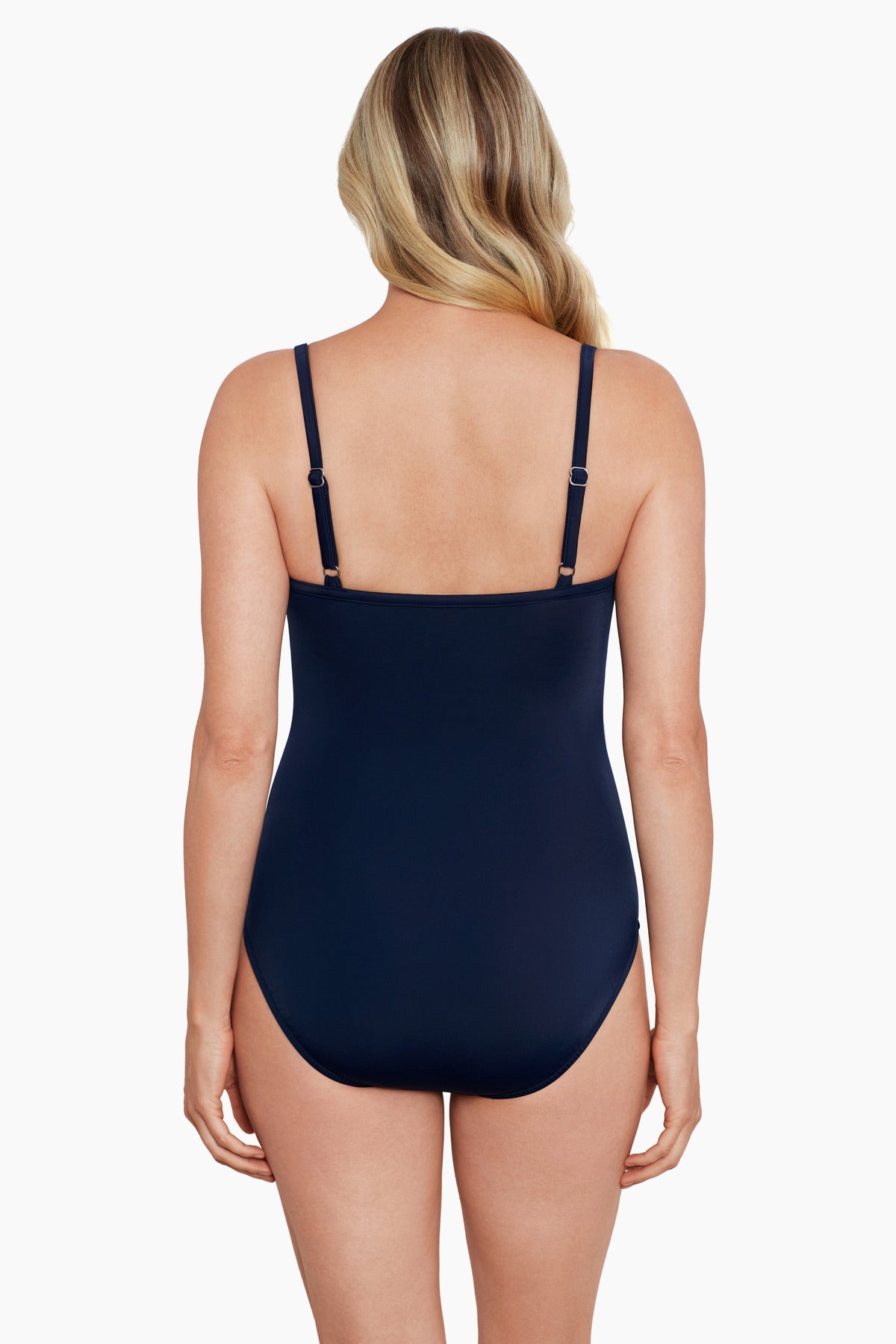 Woman faced away wearing a blue abstract printed criss cross one-piece swimsuit