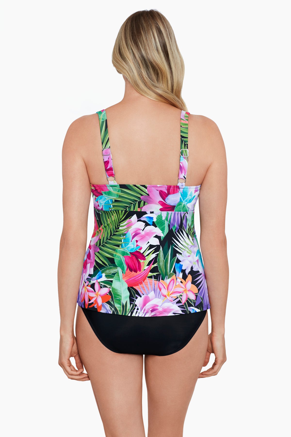 Woman turned away wearing a tropical printed tiered ruffle tankini top 