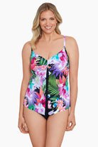 Woman wearing a tropical printed middle split tankini top
