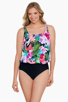 Woman wearing a tropical printed blouson one-piece swimsuit
