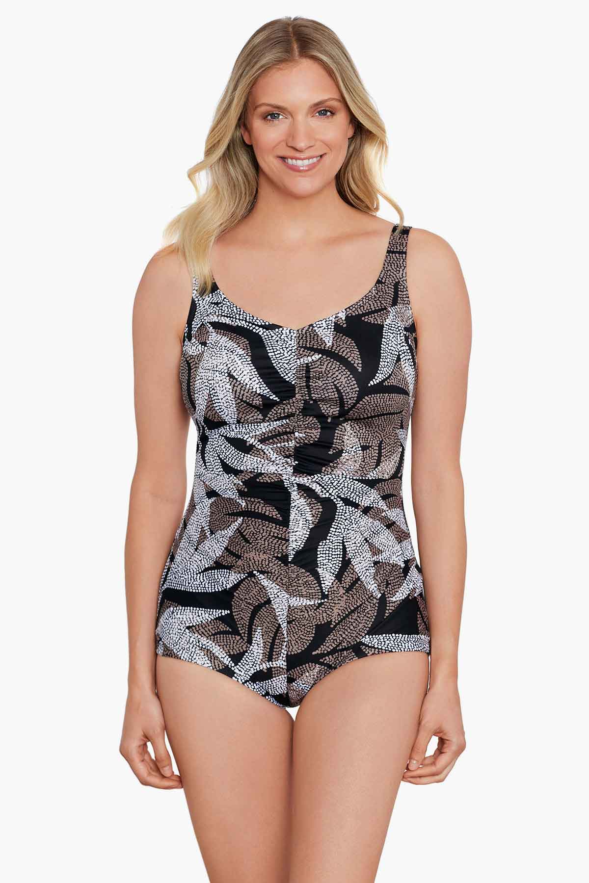 Woman wearing a dotted leaf pattern one-piece swimsuit