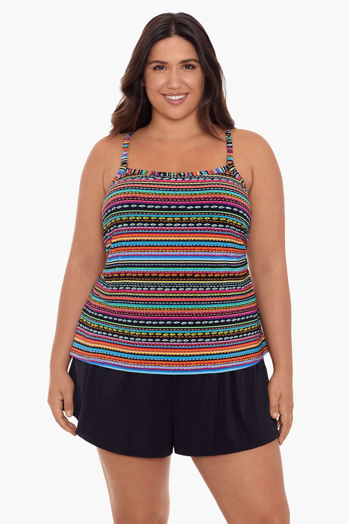 Woman wearing a rainbow stripe and dash pattern swim romper