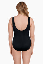 Woman turned away wearing a multi printed chain and animal printed bodice one-piece swimsuit
