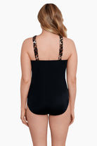 Woman turned away wearing a cheetah print cross over drape high neck swimsuit one-piece swimsuit
