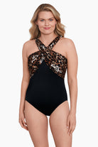 Woman wearing a cheetah print cross over drape high neck swimsuit one-piece swimsuit