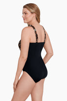 Woman turned left wearing a cheetah print cross over drape high neck swimsuit one-piece swimsuit