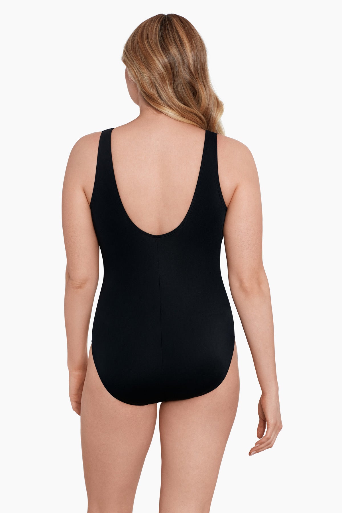 Woman turned away wearing a cheetah print belted surplice one-piece swimsuit