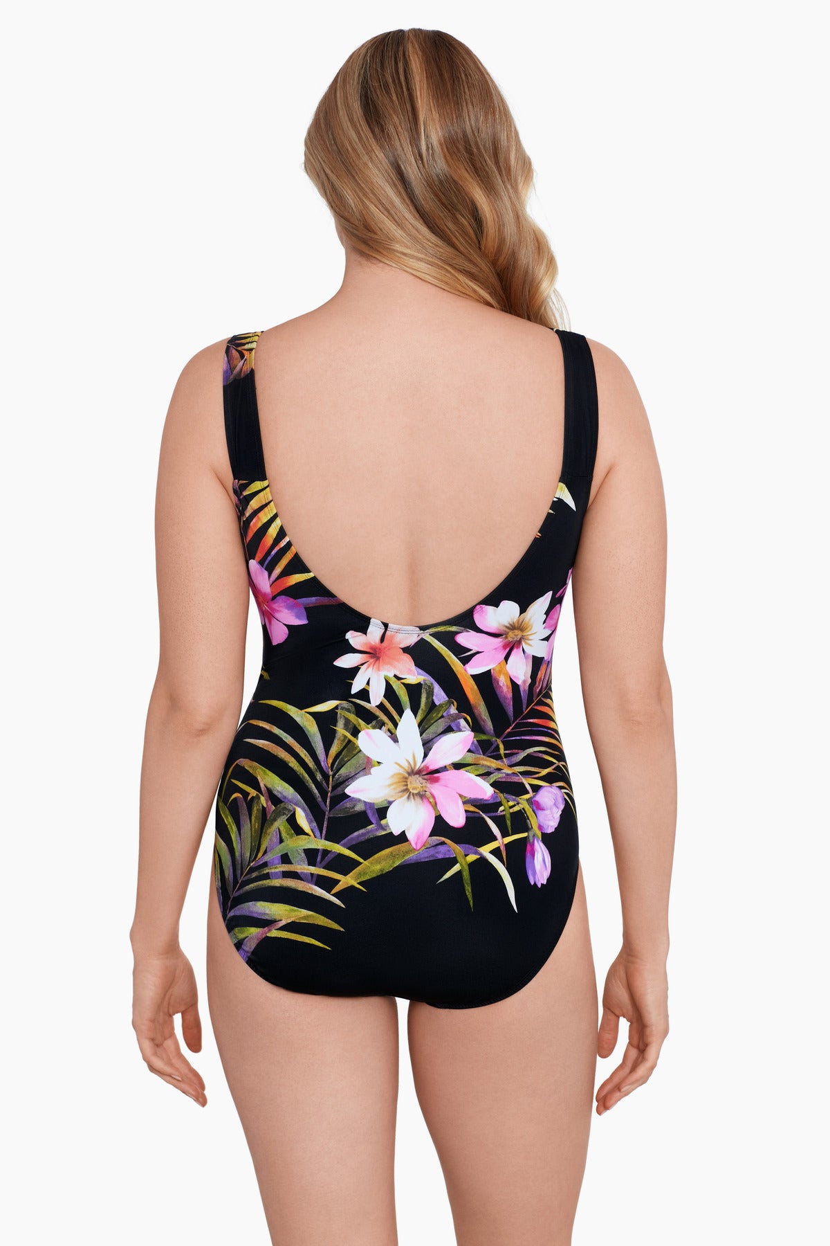 Woman turned away wearing a multicolored floral printed scoop neck tank one-piece swimsuit