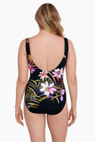 Woman turned away wearing a multicolored floral printed scoop neck tank one-piece swimsuit