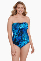 Woman wearing a black and blue abstract animal printed one-piece bandeau swimsuit